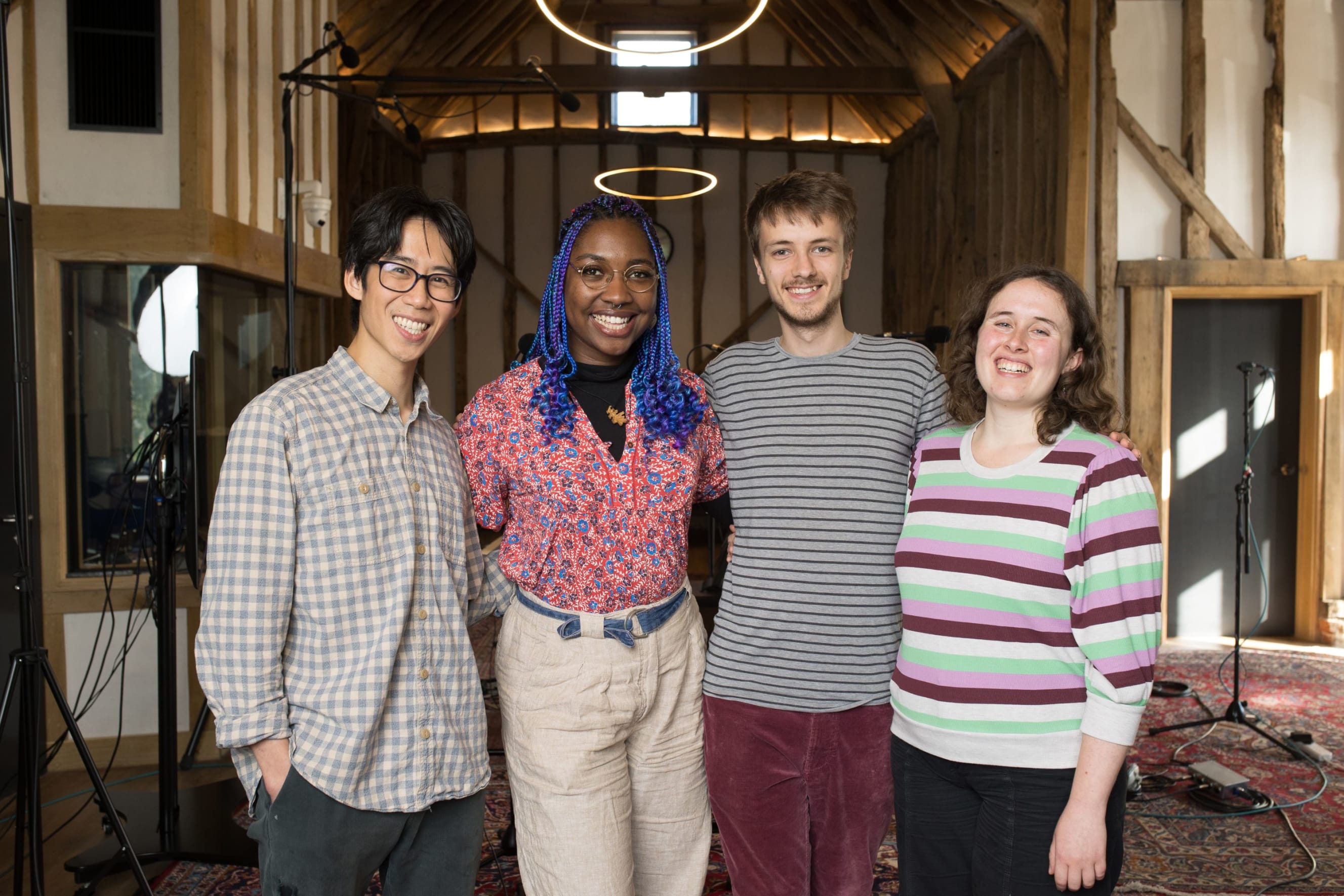 Informal shot of young composers Millicent, Alex, Emily and Will in a recording studio